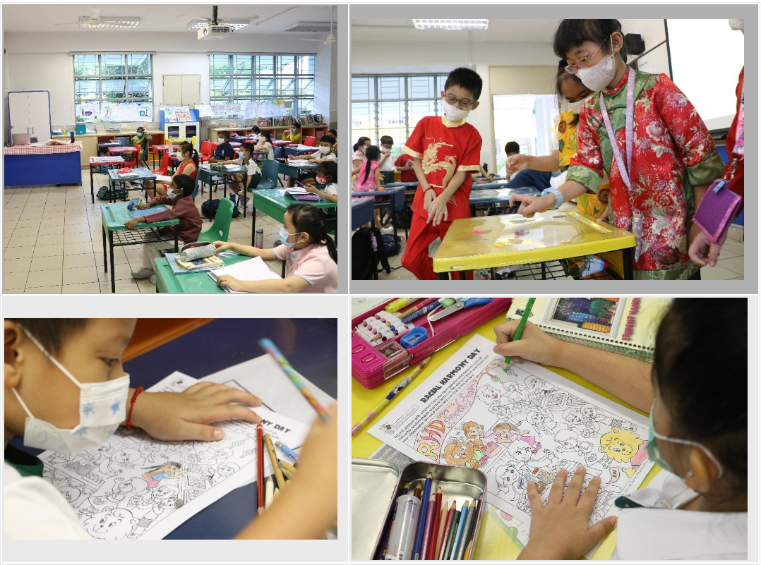 Children wearing masks in a classroom color Racial Harmony Day worksheets while a teacher in traditional dress assists a student.